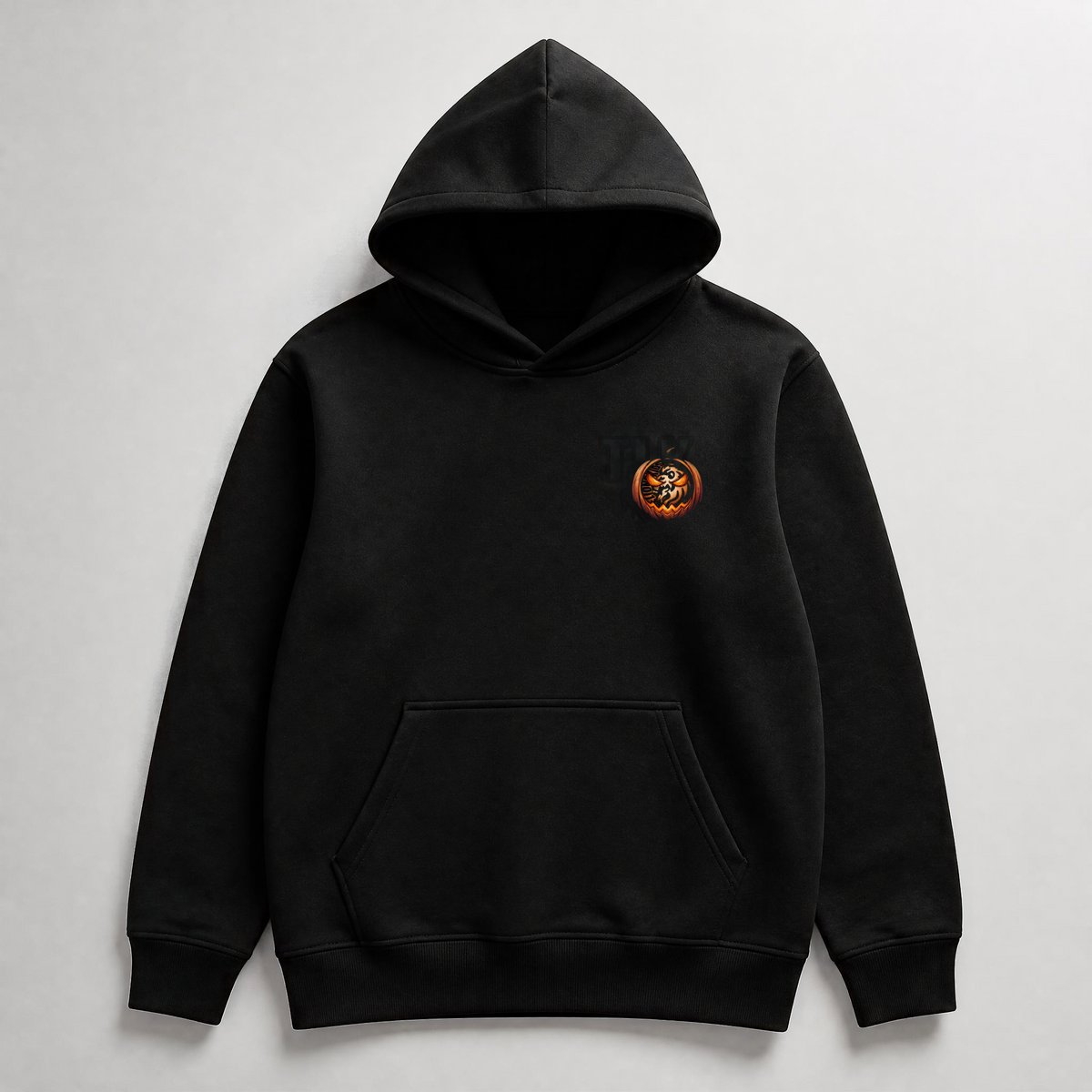 Sudadera negra infantil TLK Pumpkin con capucha sin cordones y pequeño diseño de calabaza con león en el pecho